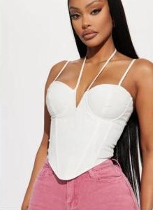White sweetheart corset top styled with pink jeans